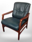 A Continental stained wooden armchair in green leather upholstery
