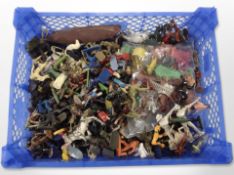 A crate of plastic soldiers and other figures