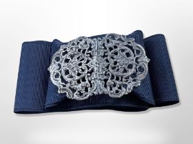 A silver nurse's buckle on belt