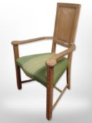 A continental carved oak panel back armchair,
