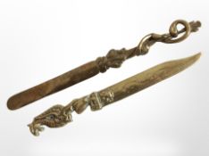 Two ornate brass letter knives, longest 22cm.