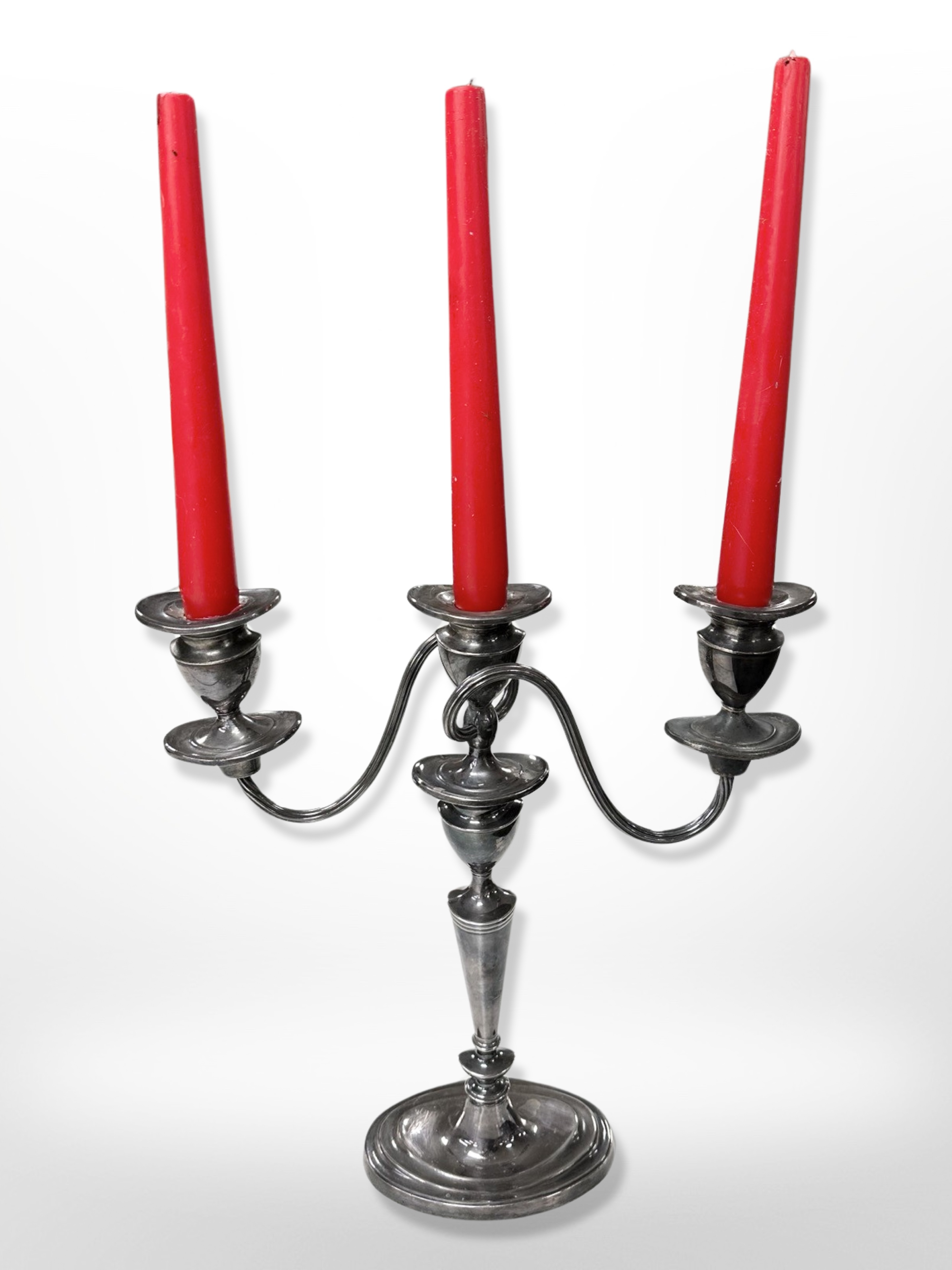 A silver-plated three-sconce candelabrum,
