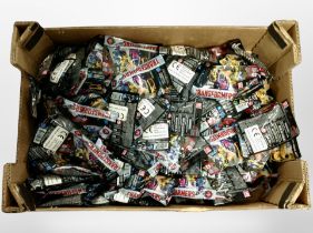 A box of Hasbro Transformers miniature bagged toys.