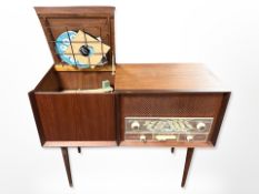 A vintage Danish teak cased record player containing a Philips turn table,