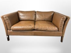 A late 20th century Danish brown stitched leather two seater settee,