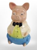 A 1930s ceramic money box in the form of a pig, height 24cm.
