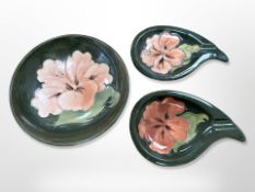 Three pieces of Moorcroft pink hibiscus pottery to include a bowl, diameter 14.