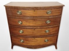 A 19th century mahogany and satinwood strung bow fronted chest of four drawers,