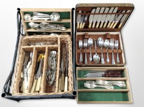 A crate of oak cutlery canteen of stainless steel cutlery,