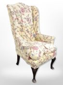 An early 20th century lady's wing backed armchair