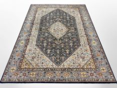 A machine-made rug of Tabriz design,