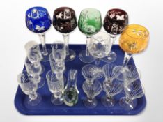 A group of drinking glasses including five coloured hock glasses,