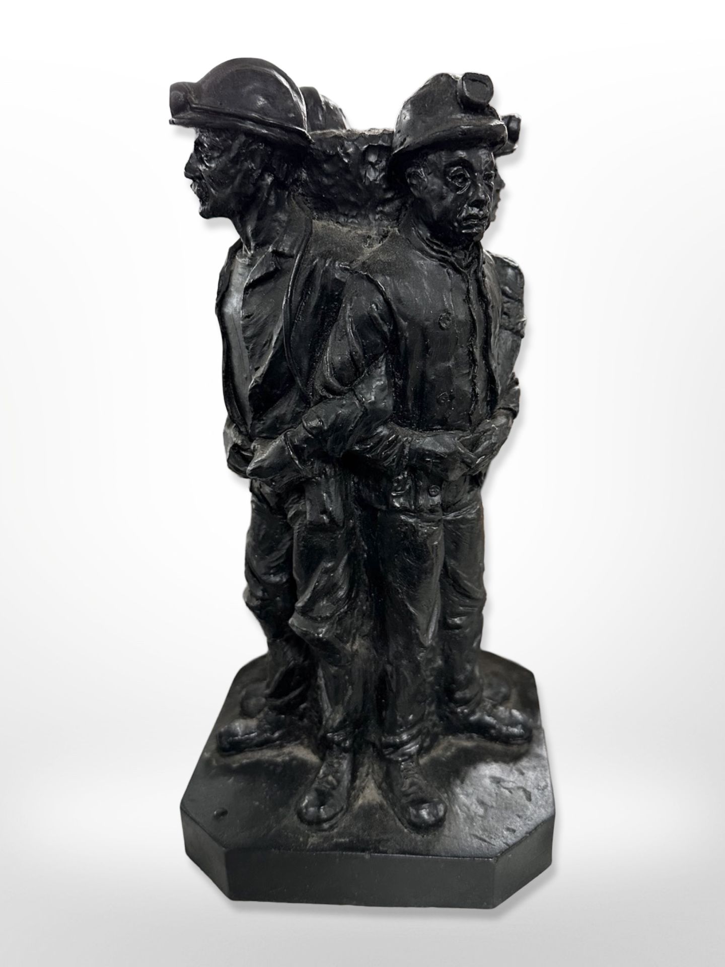 A contemporary figure group of four miners entitled 'The last shift'