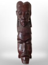 An African hardwood carving of two faces,
