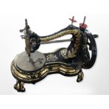A Victorian gilded cast iron sewing machine, retailed by Fattorini & Sons, Bradford,