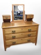 A satin walnut three drawer dressing chest,