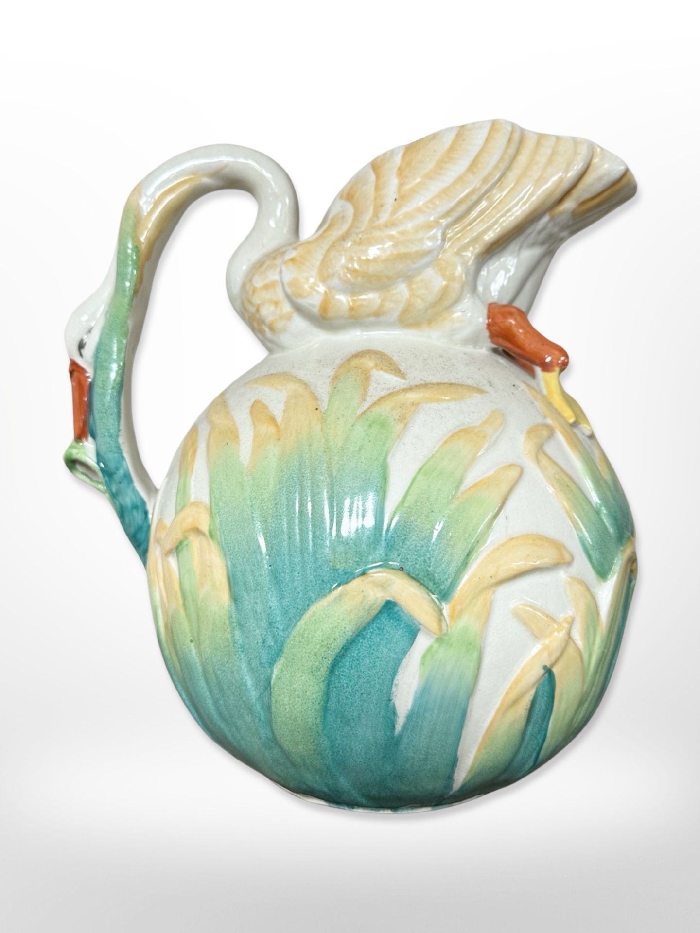 An early 20th century English pottery jug, the handle and spout in the form of a swan,