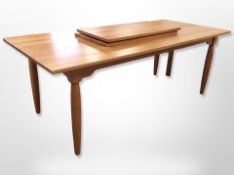 A Danish Gramrode Mobelfabrik extending dining table with two leaves,