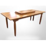 A Danish Gramrode Mobelfabrik extending dining table with two leaves,