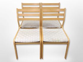 Four Danish beech ladder back dining chairs with canvas webbed seats