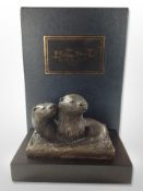 A contemporary cast bronze figure of two otters on plinth by The Bronze Art casting company,