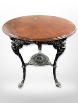 A Brittania pub table with mahogany top, the cast iron base stamped N E B Ltd, Sunderland,