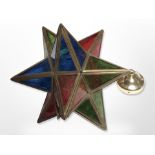 A brass and coloured glass star light shade