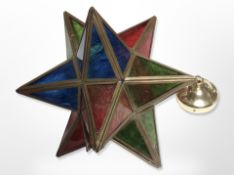 A brass and coloured glass star light shade