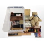 A teddy bear and a quantity of dominoes, draughts set, other games,