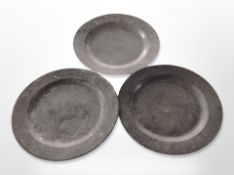 Three 18th century pewter plates,
