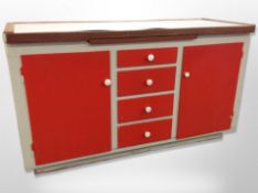 A mid 20th century painted kitchen cabinet with melamine top,