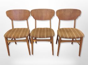 A set of six Danish teak dining chairs in striped brown upholstery