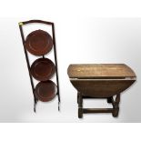 A mahogany three-tier cake stand and small drop leaf table