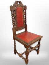 A heavily carved oak barley twist chair