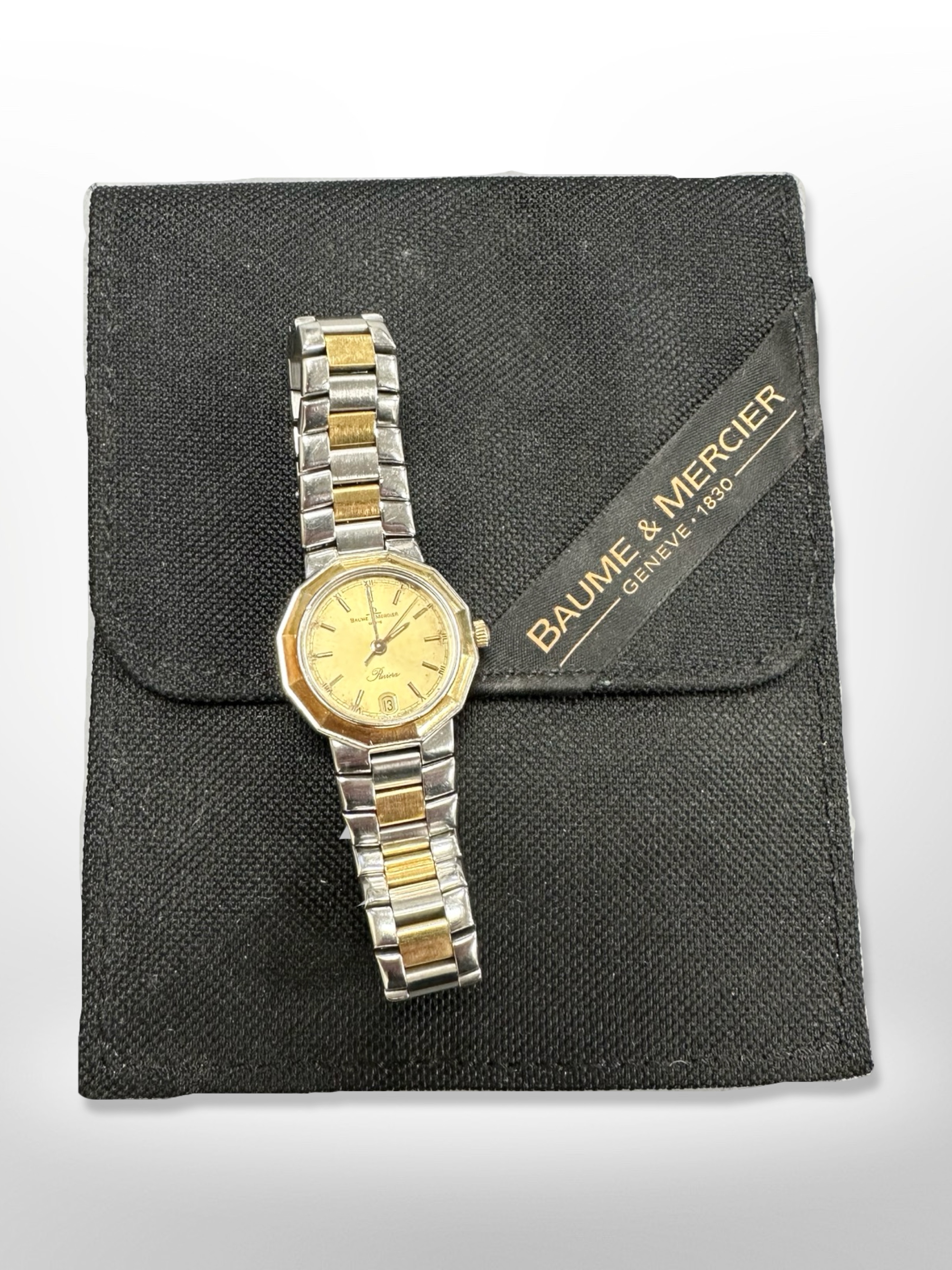 A bi-mettalic Baume & Mercier wristwatch in pouch