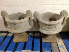 A pair of concrete twin-handled garden urns, height 52cm.