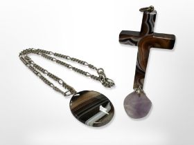 A polished agate pendant on chain,