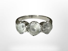 A platinum three-stone dress ring, size J/K CONDITION REPORT: 4.