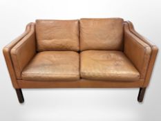 A late 20th century Danish Thams Kvalitet stitched brown leather two seater settee,