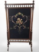 An early 20th century embroidered oak screen,