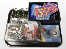 A group of trading cards including Pokemon, Captain Scarlet,