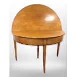 A 19th century continental satin wood circular fold out table,