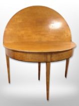 A 19th century continental satin wood circular fold out table,