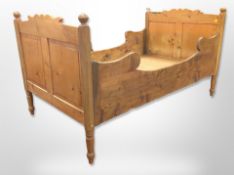 A late 19th century pine bed frame,