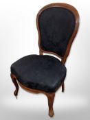 A Continental walnut salon chair in black floral upholstery