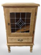 A Danish oak and stained glass side cabinet,