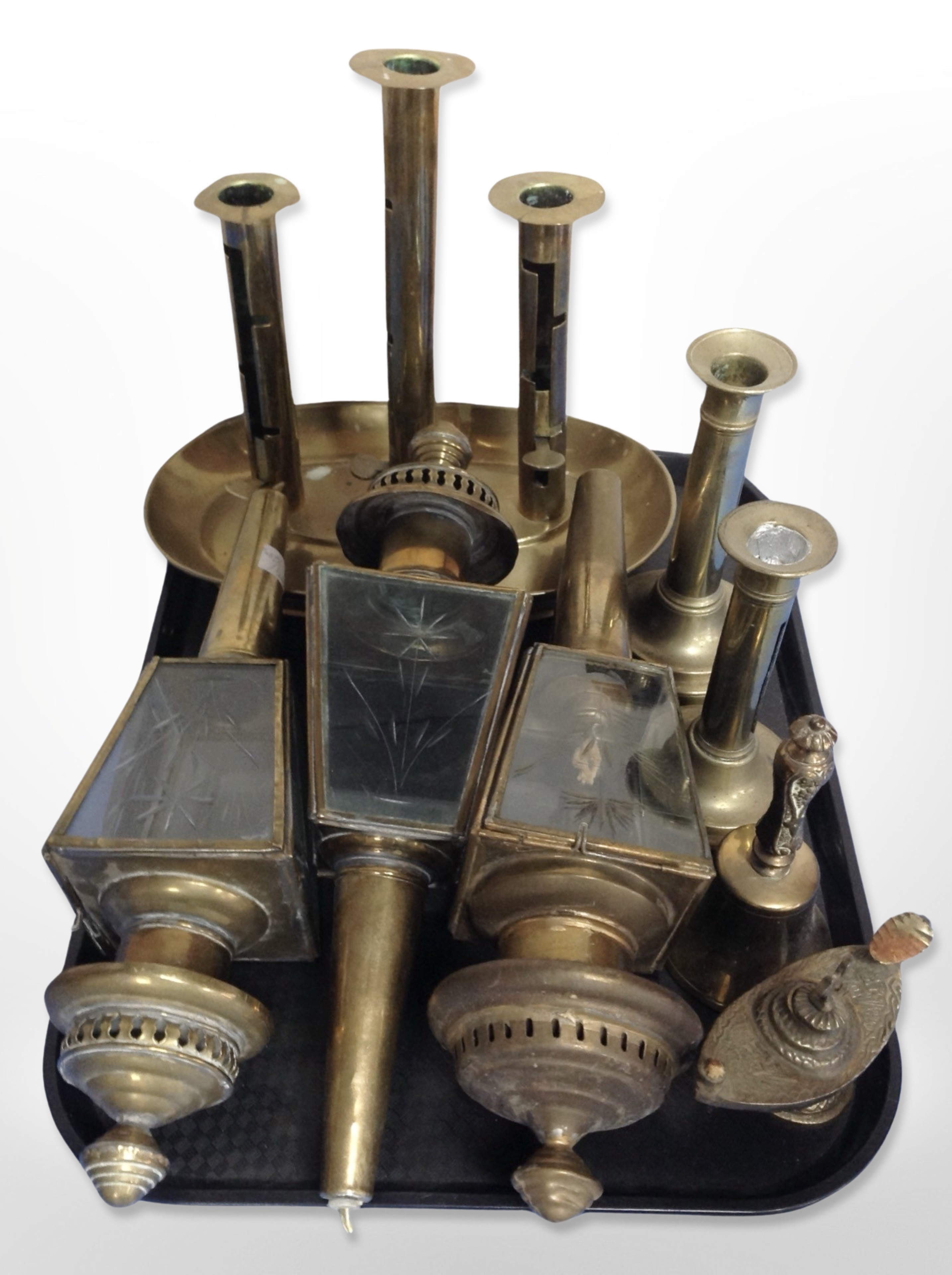 A group of brass to include triple sconce ejector candlestick, carriage lanterns,