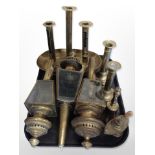 A group of brass to include triple sconce ejector candlestick, carriage lanterns,