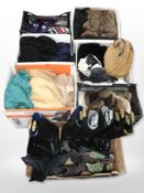 A pallet of assorted clothing, leather boots, furs, ties,