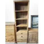 A contemporary Barker & Stonehouse hardwood bookcase fitted with three drawers,